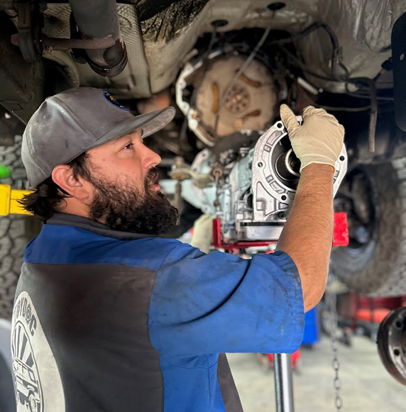 technician fixing brakes